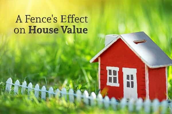 A small toy house with a toy fence sits in real grass with the words "A Fence's Effect on Home Value"